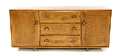 Lot 694 - An Ercol elm sideboard