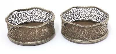 Lot 42 - A pair of George III silver wine coasters