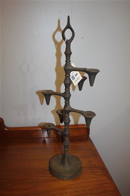 Lot 394 - A pair of cast iron candle trees