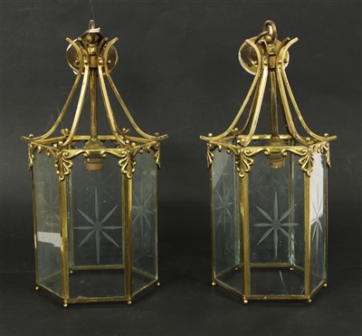 Lot 392 - A pair of Regency style brass hexagonal lanterns