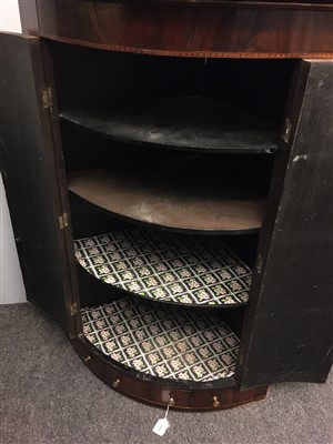 Lot 1681 - A George III inlaid mahogany bow front hanging corner cupboard