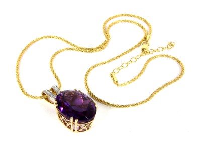 Lot 156 - A 14ct gold amethyst and diamond pendant