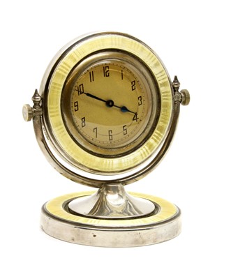 Lot 349 - A Swiss silver/yellow enamel swivel desk clock