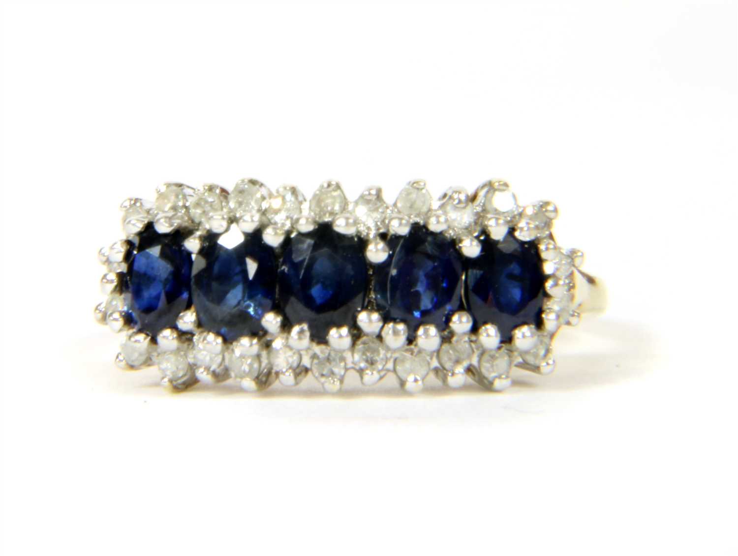 Lot 147 - A 9ct gold sapphire and diamond ring