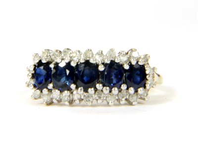 Lot 147 - A 9ct gold sapphire and diamond ring