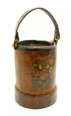 Lot 522 - A leather horse feeding bucket with coat of arms and strap