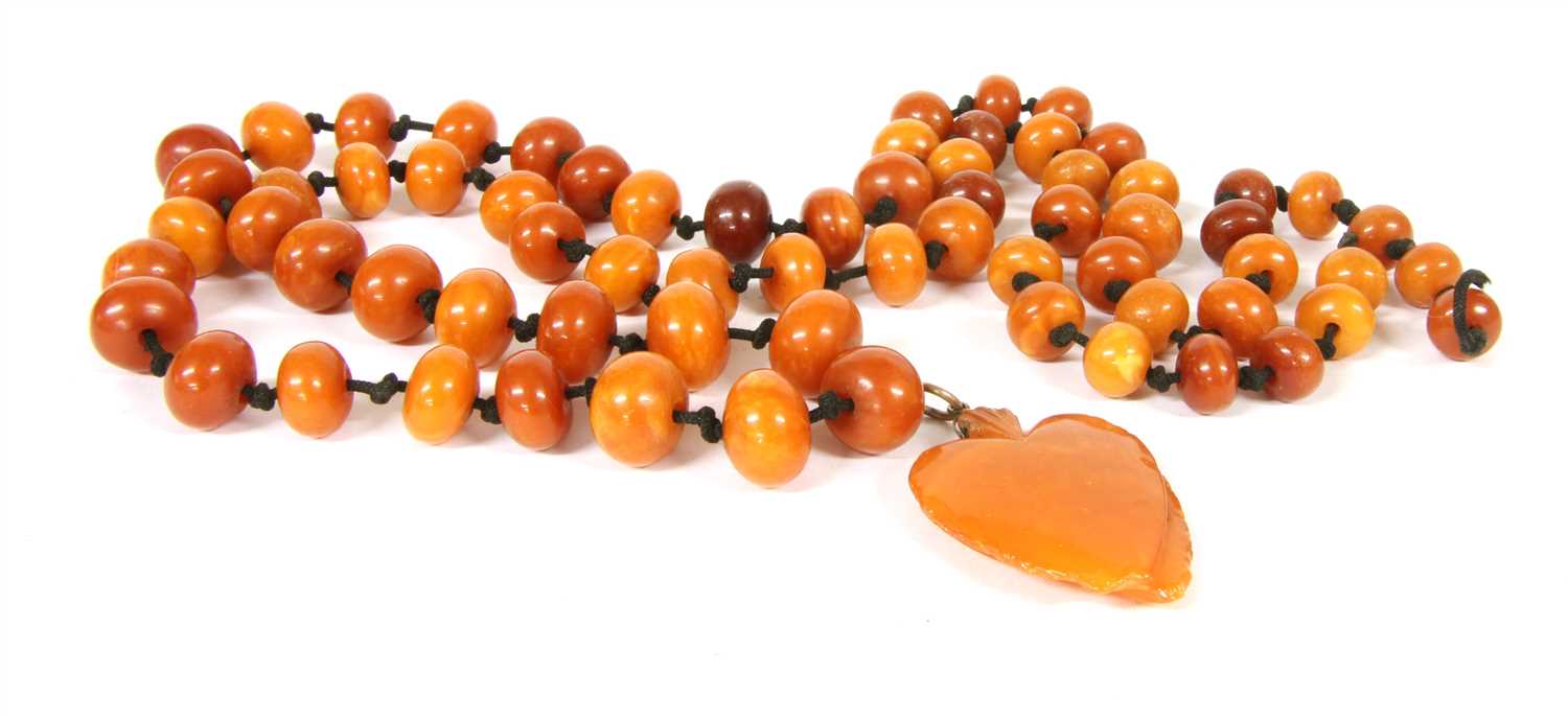 Lot 38 - A single row graduated bouton shaped butterscotch amber bead necklace