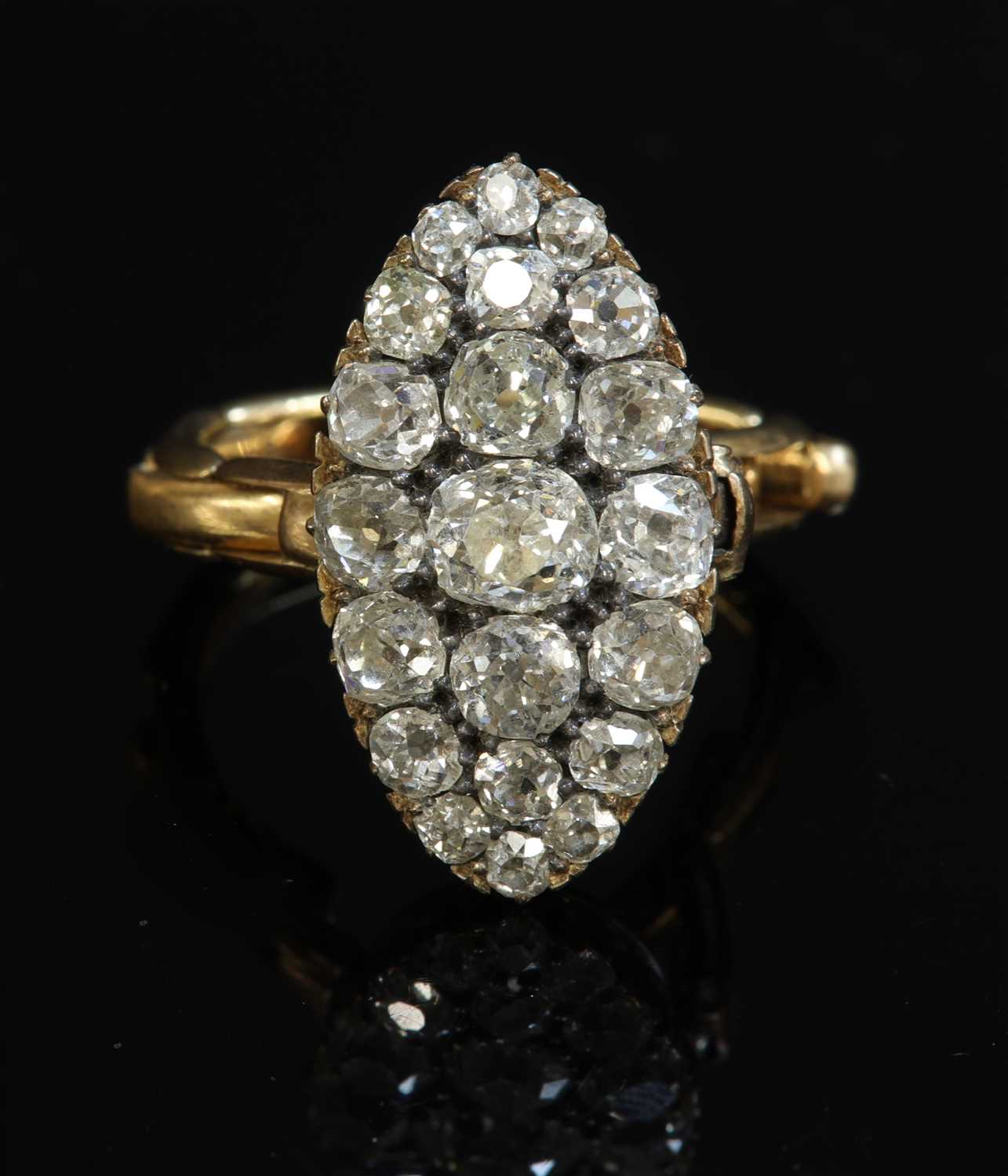 Lot 74 - A late Victorian diamond set marquise shaped cluster ring, c.1900