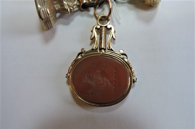 Lot 13 - A Georgian gold hardstone swivel seal