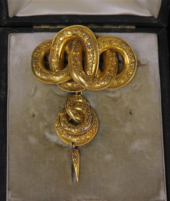 Lot 29 - A cased Victorian Etruscan-style knot brooch, c.1870
