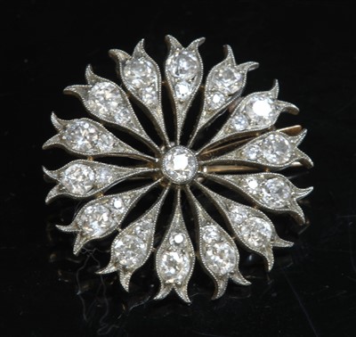 Lot 175 - A diamond set flower head brooch/pendant, c.1890