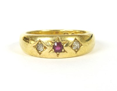 Lot 47 - An 18ct gold ruby and diamond three stone gypsy ring