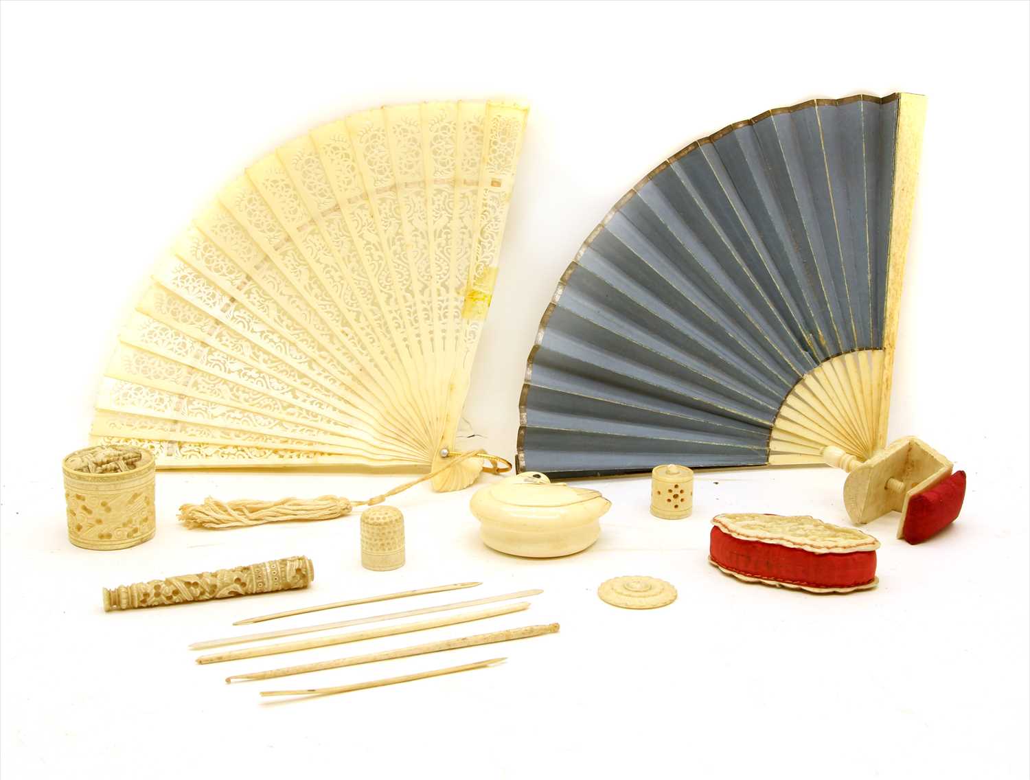 Lot 237 - A small collection of Chinese and European carved ivory sewing accoutrements