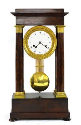 Lot 761 - A mahogany French Empire portico clock