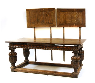 Lot 757 - An oak extending refectory table