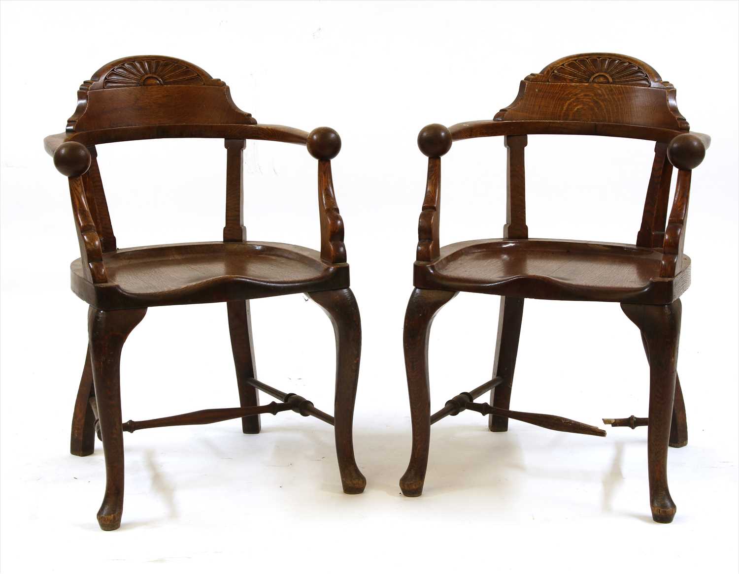 Lot 88 - A pair of unusual oak smokers' bow elbow chairs