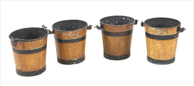 Lot 817 - A set of four metal coal buckets