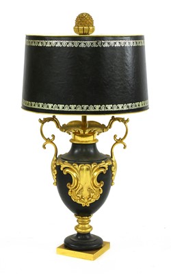 Lot 757 - A gilt and black metal table lamp