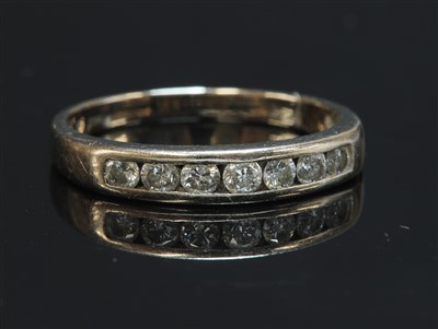 Lot 474 - An 18ct white gold diamond set half eternity ring