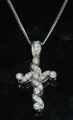 Lot 463 - An 18ct white gold diamond set cross and chain