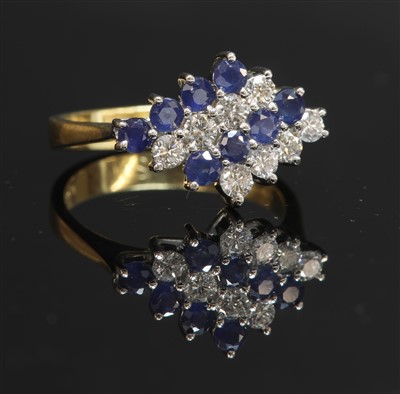Lot 306 - An 18ct gold sapphire and diamond lozenge-shaped cluster ring