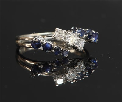 Lot 522 - An 18ct white gold three row diamond and sapphire band ring