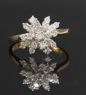 Lot 347 - An 18ct gold diamond set snowflake cluster ring