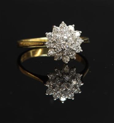 Lot 331 - An 18ct gold three-tier diamond cluster ring