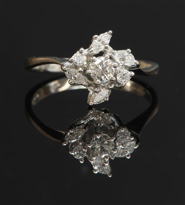 Lot 411 - An 18ct white gold diamond cluster crossover ring