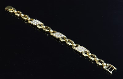 Lot 378 - A gold geometric link diamond set bracelet