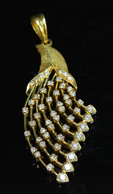 Lot 112 - A gold diamond set spray pendant