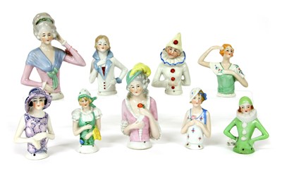 Lot 380 - Nineteen china pin cushion dolls