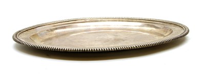 Lot 319 - A George III silver serving plate