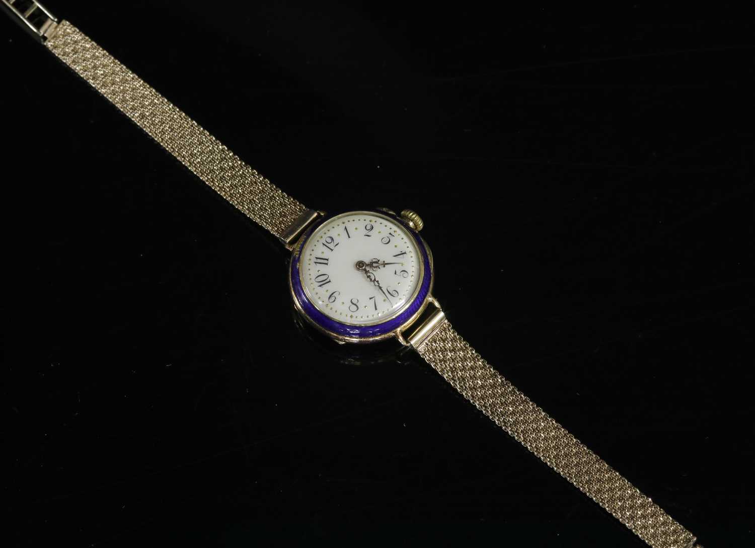 A ladies' French gold and enamel early mechanical strap watch,