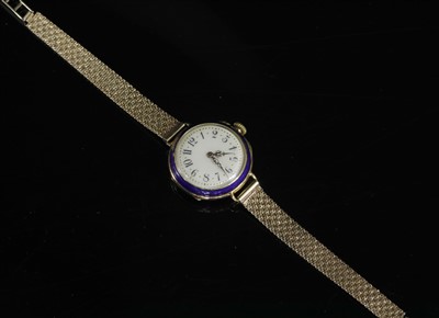 Lot 110 - A ladies' French gold and enamel early mechanical strap watch