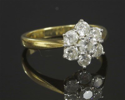 Lot 329 - An 18ct gold diamond set cluster ring