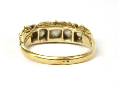 Lot 6 - A Victorian five stone diamond carved head ring