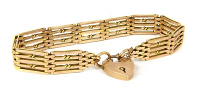 Lot 257 - A gold five row gate link bracelet