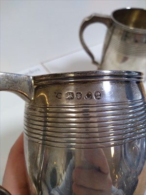 Lot 4 - A pair of George III silver mugs