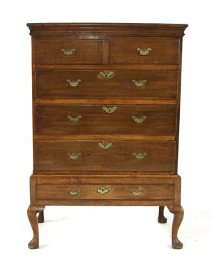 Lot 624 - A George III oak chest on stand