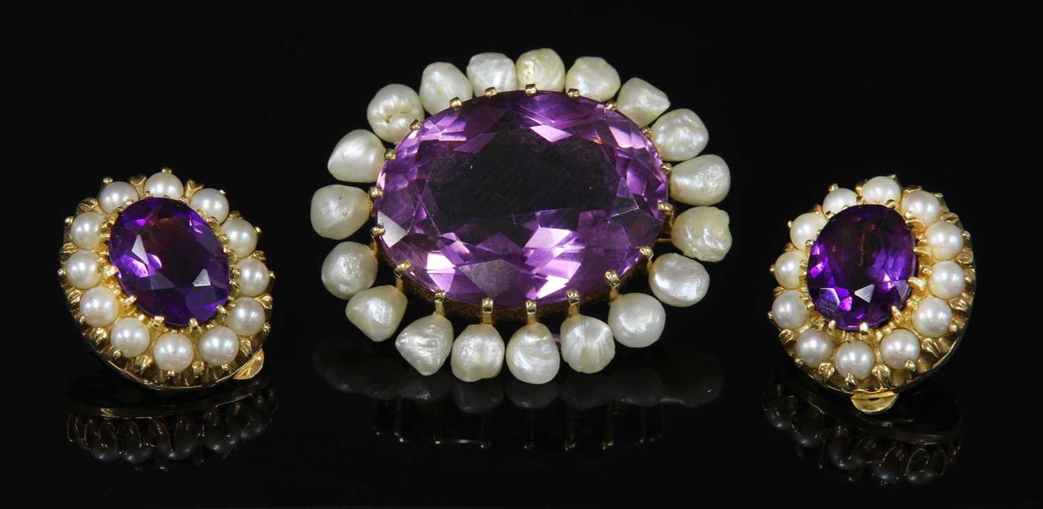Lot 45 - A late Victorian gold amethyst and pearl oval brooch