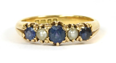 Lot 103 - An 18ct gold five stone sapphire and split pearl ring