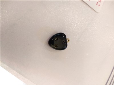 Lot 10 - A hinged black and blue enamel heart shaped locket