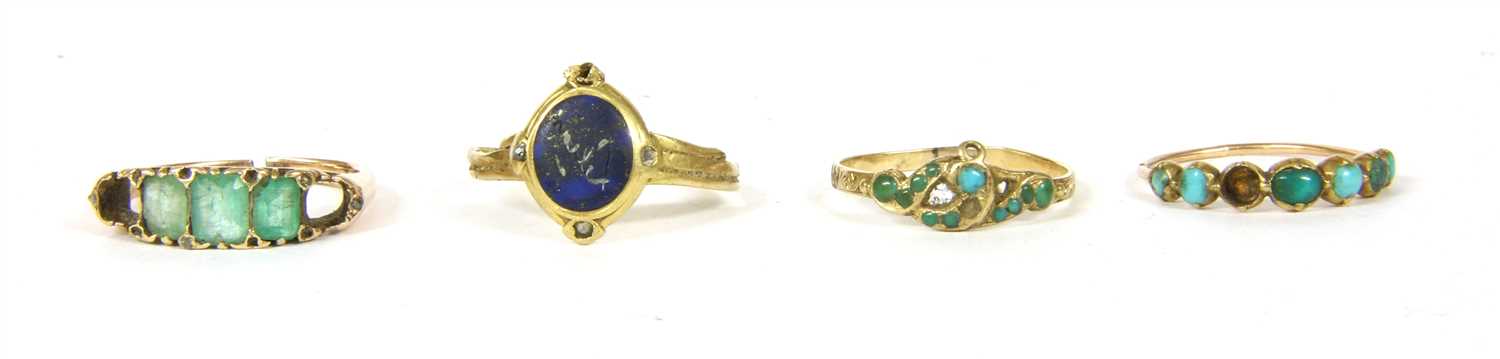 Lot 52 - A gold five stone emerald cut emerald ring