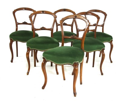 Lot 699 - Six walnut balloon back chairs