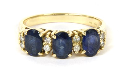 Lot 115 - An eleven stone sapphire and diamond ring