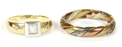 Lot 109 - A gold three colour twisted band ring