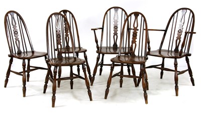 Lot 660 - A set of six oak and elm hoop back dining chairs