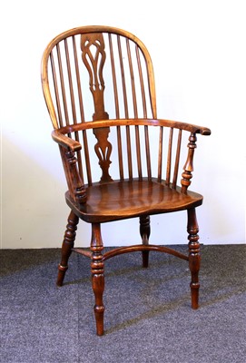 Lot 596 - A mid 19th century and yew Windsor armchair