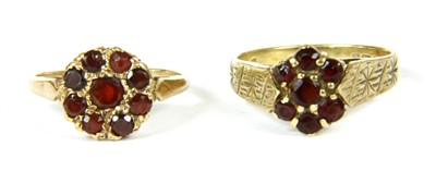 Lot 306 - An 18ct gold five stone garnet-and-glass doublet and diamond gypsy ring